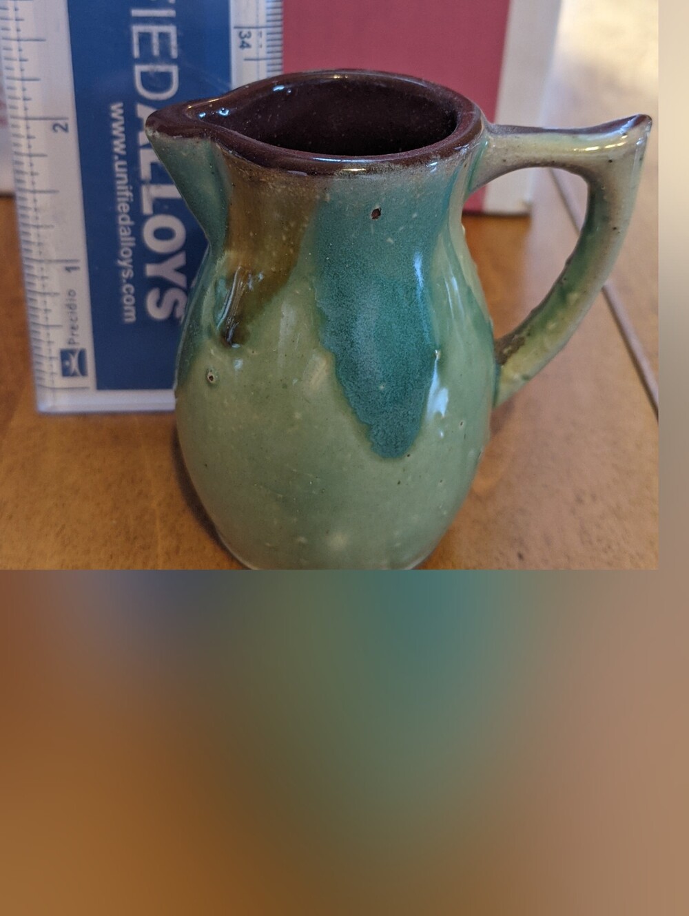 Vintage Handmade Glazed Ceramic Pitcher in Green with Brown Rim